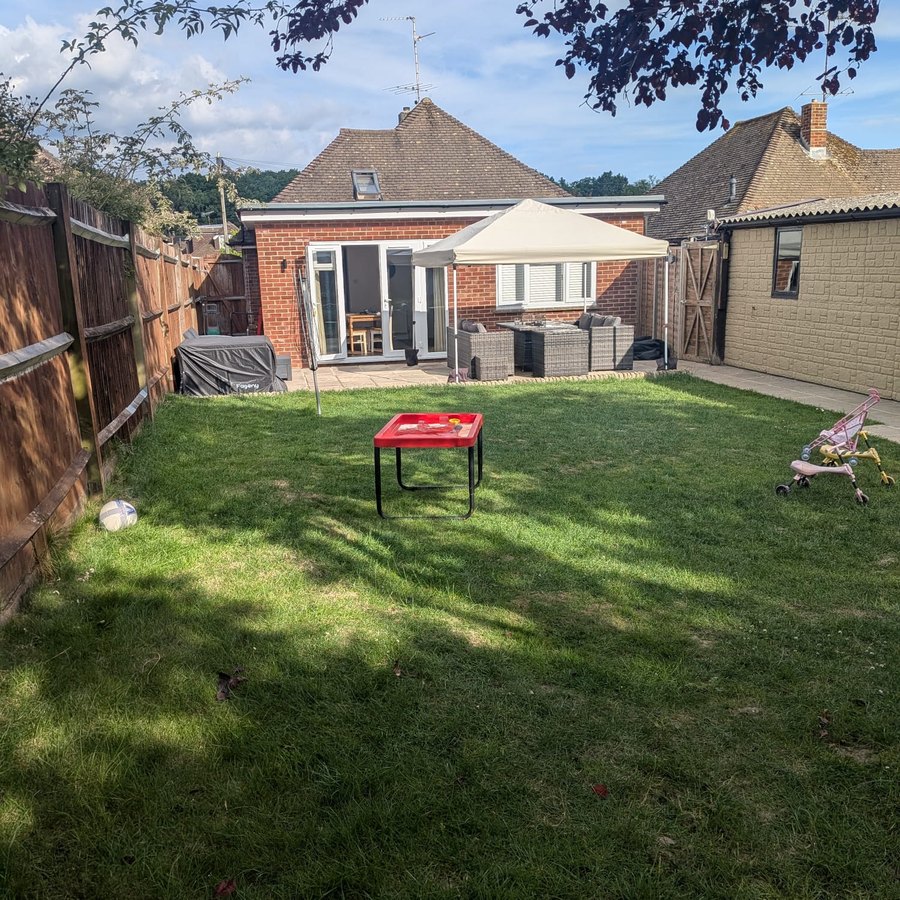 The setting, a home with a large open-plan extension and patio
